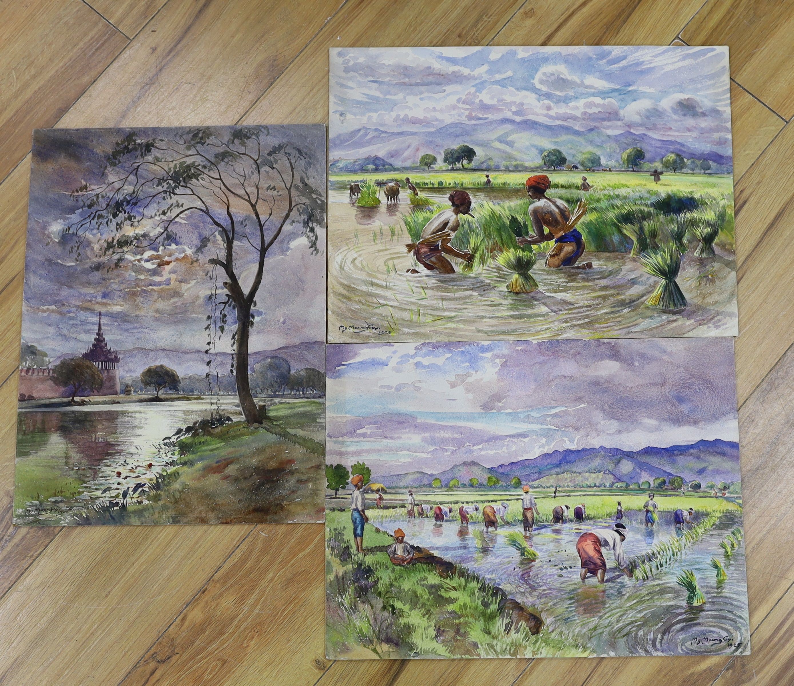 Mg Maung Gy (Burmese 1890-1942), three watercolours, Rice planters and River landscapes, signed and dated 1925, 34 x 45cm and 45 x 34cm, unframed